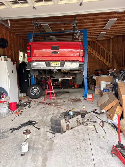 Chevy Silverado on the lift with fuel tank dropped